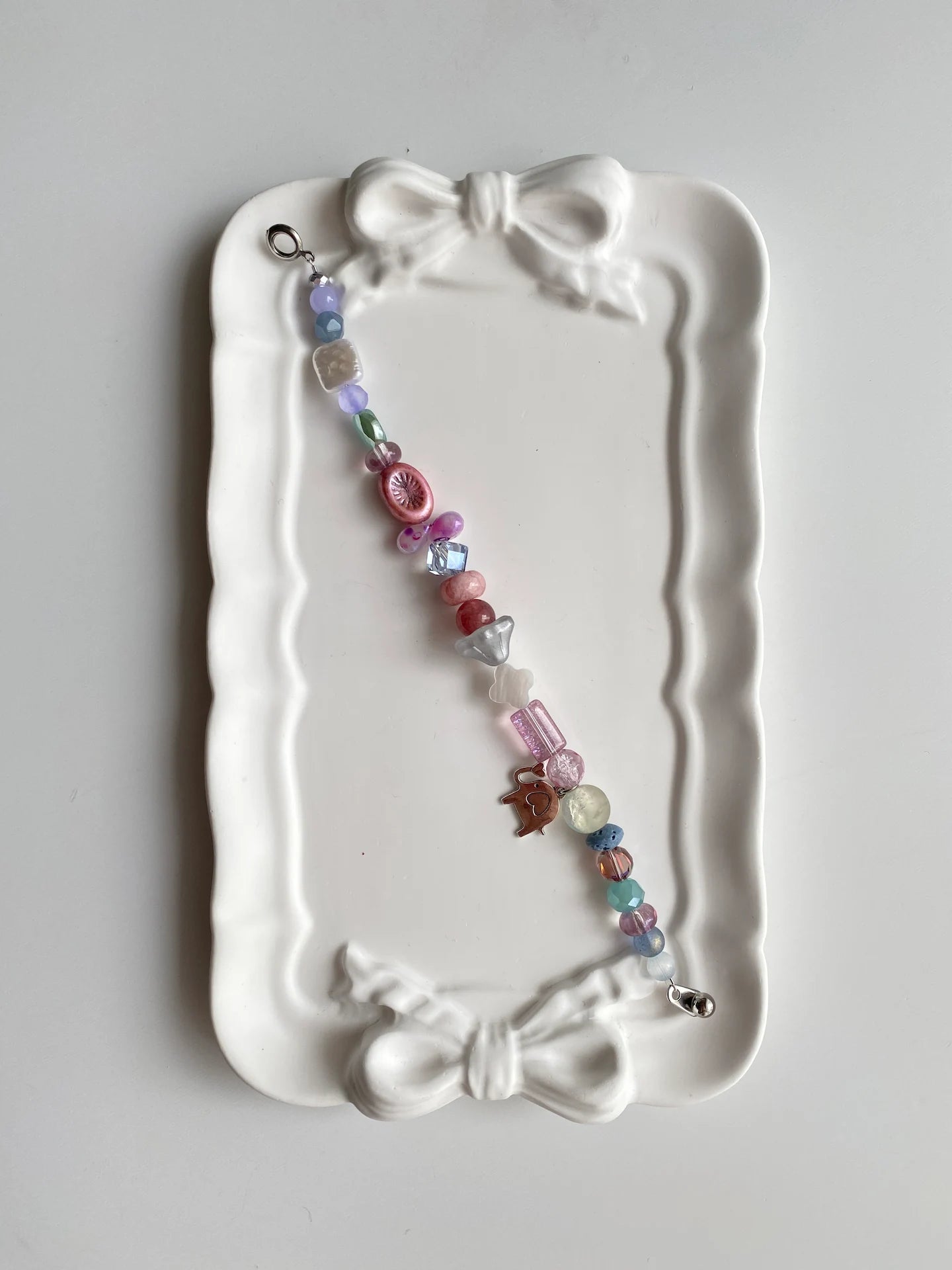 Fun pink kiwi fruit-themed bracelet with green Czech glass and pink beads.
