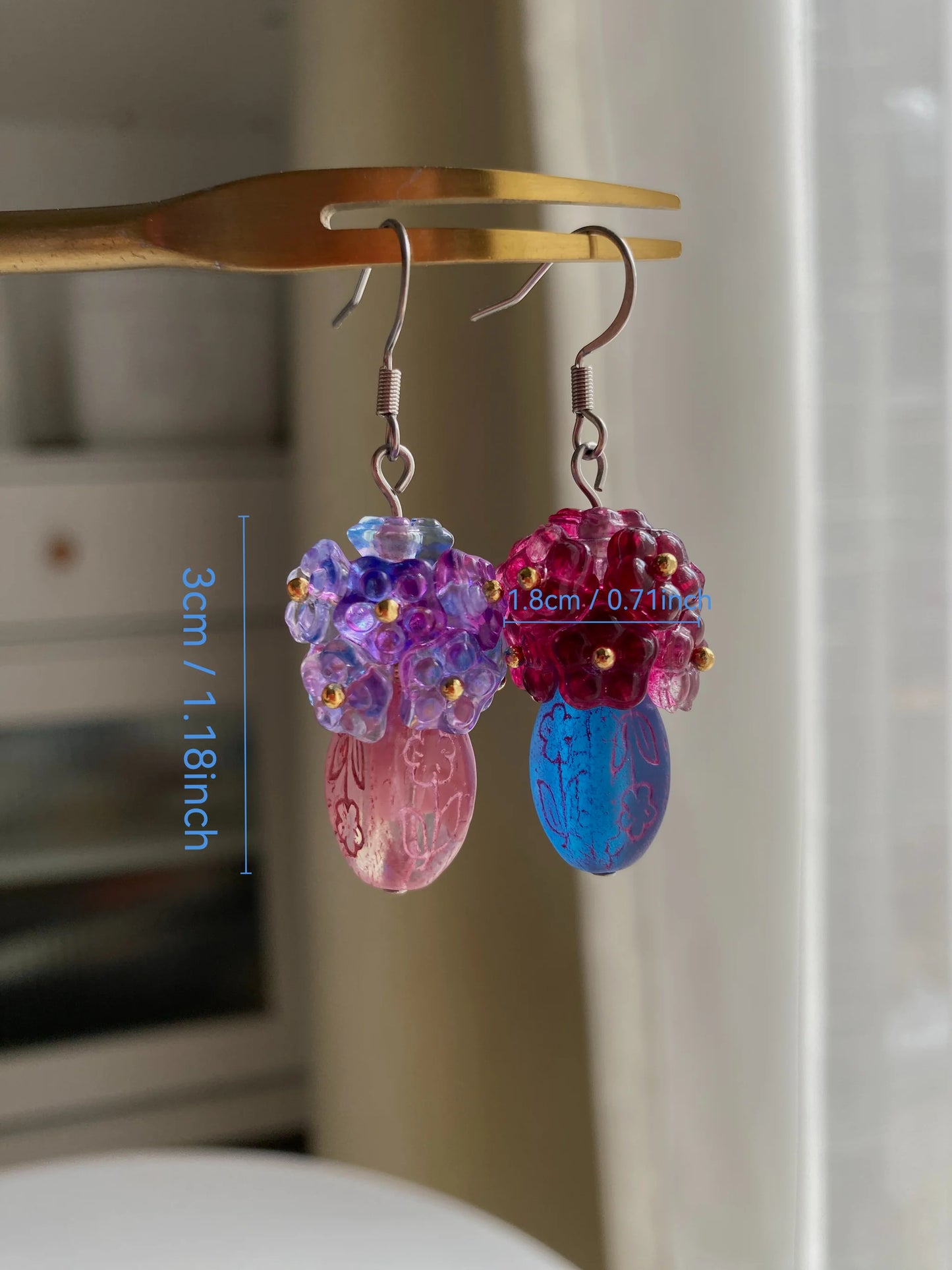 Detailed dimension check of the heavy-workmanship floral vase earrings, with size in inches marked, showing blue and purple beadwork.