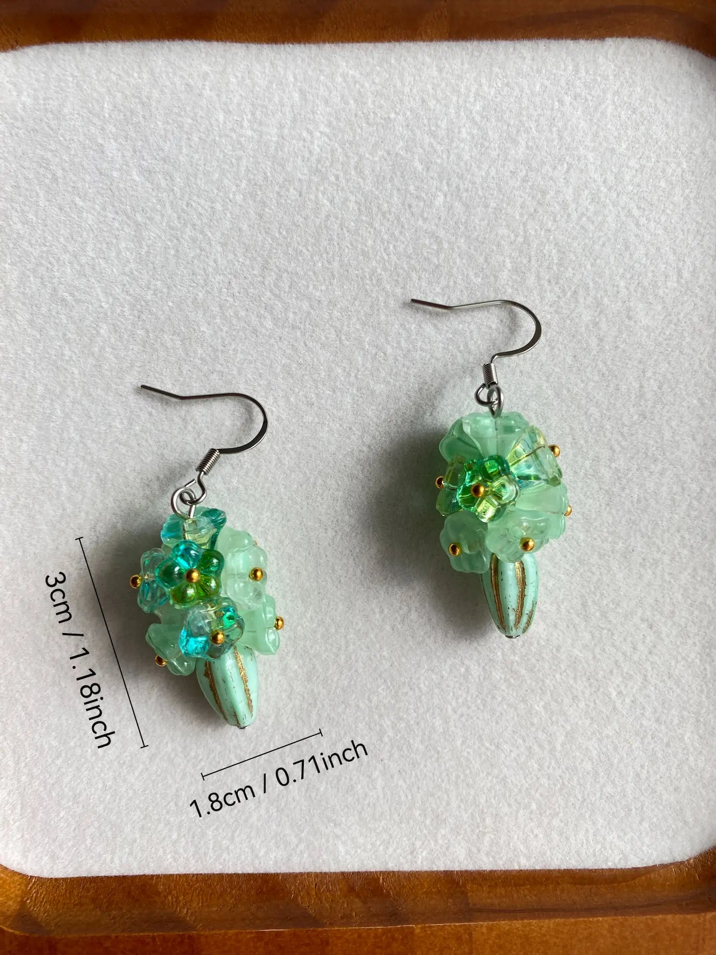 Size measurement in inches of the heavy-workmanship green beaded flower earrings with stainless steel hooks.