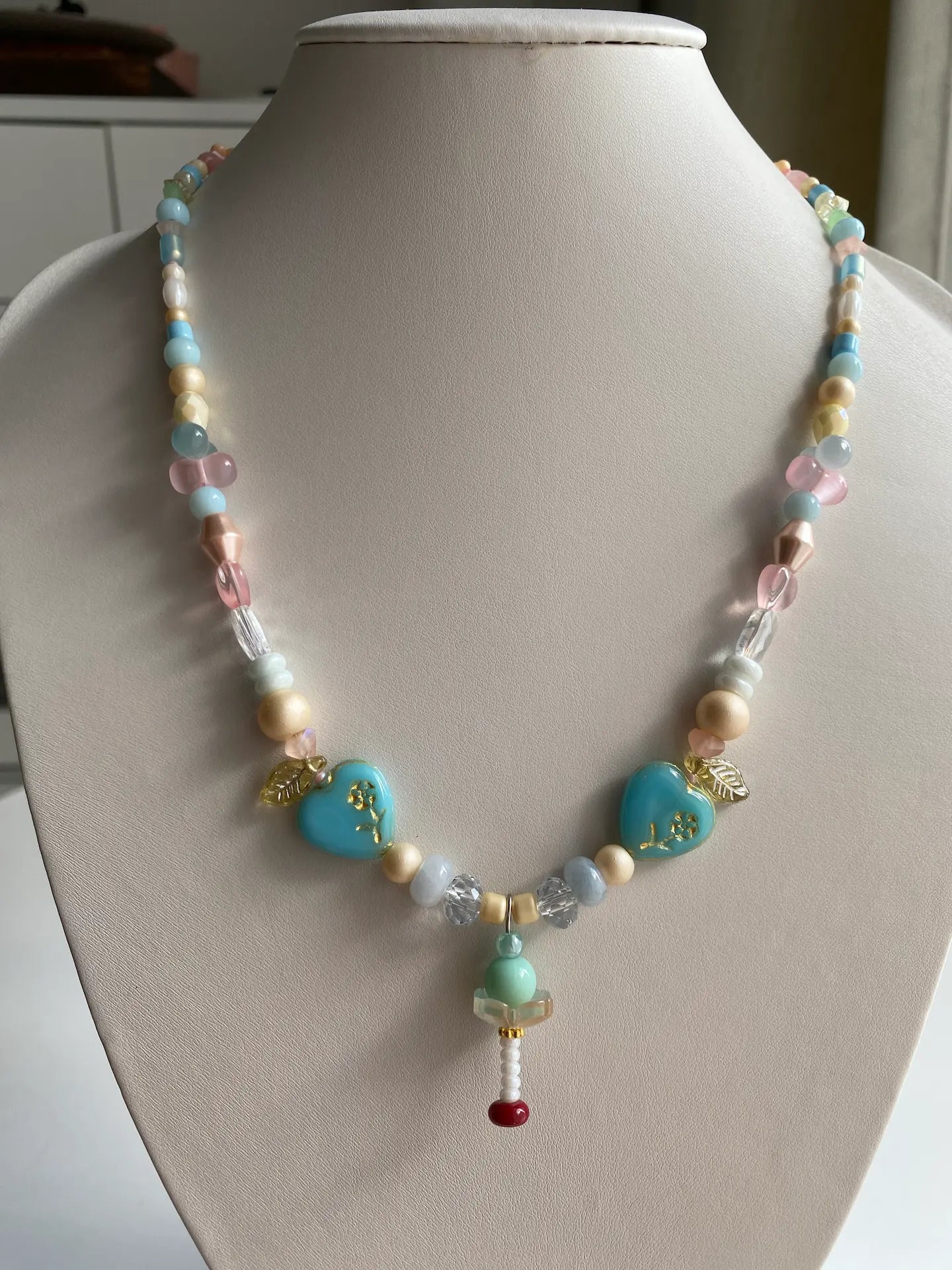 HuibenCraft 1-of-1 handmade necklace with 3D mint ice cream charm and azure glass hearts on a mannequin.