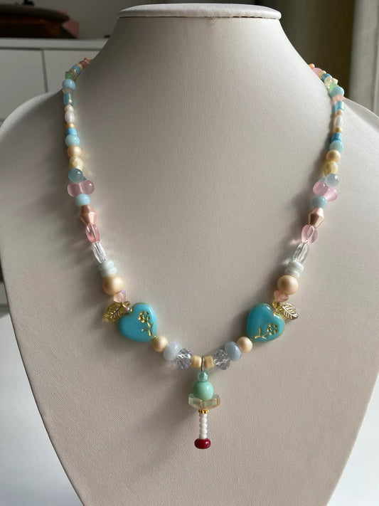 HuibenCraft 1-of-1 handmade necklace with 3D mint ice cream charm and azure glass hearts on a mannequin.