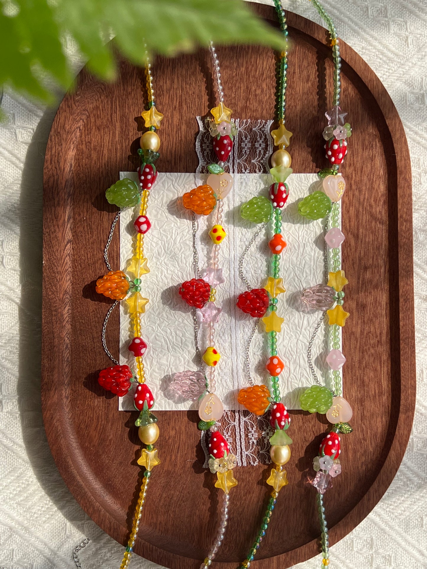 Colorful 4 mm seed beads with raspberry, strawberry and decorative glass beads.